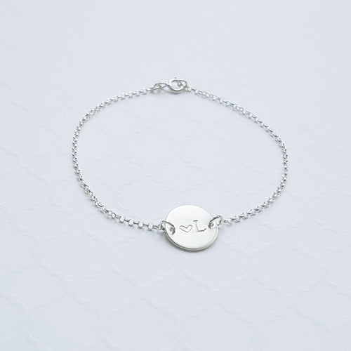 sterling silver initial disc on a rolo chain bracelet