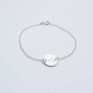 sterling silver initial disc on a rolo chain bracelet