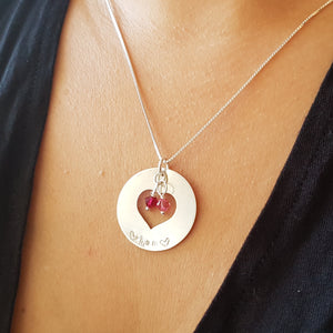 woman wearing sterling silver mom heart washer necklace with daughters' birthstones