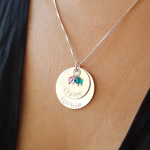 woman wearing sterling silver two-layer mom necklace with kids' names and birthstones