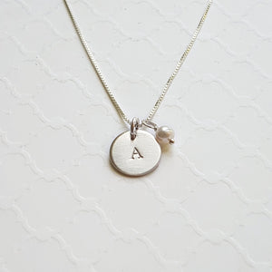 custom initial necklace with sterling silver disc and freshwater pearl
