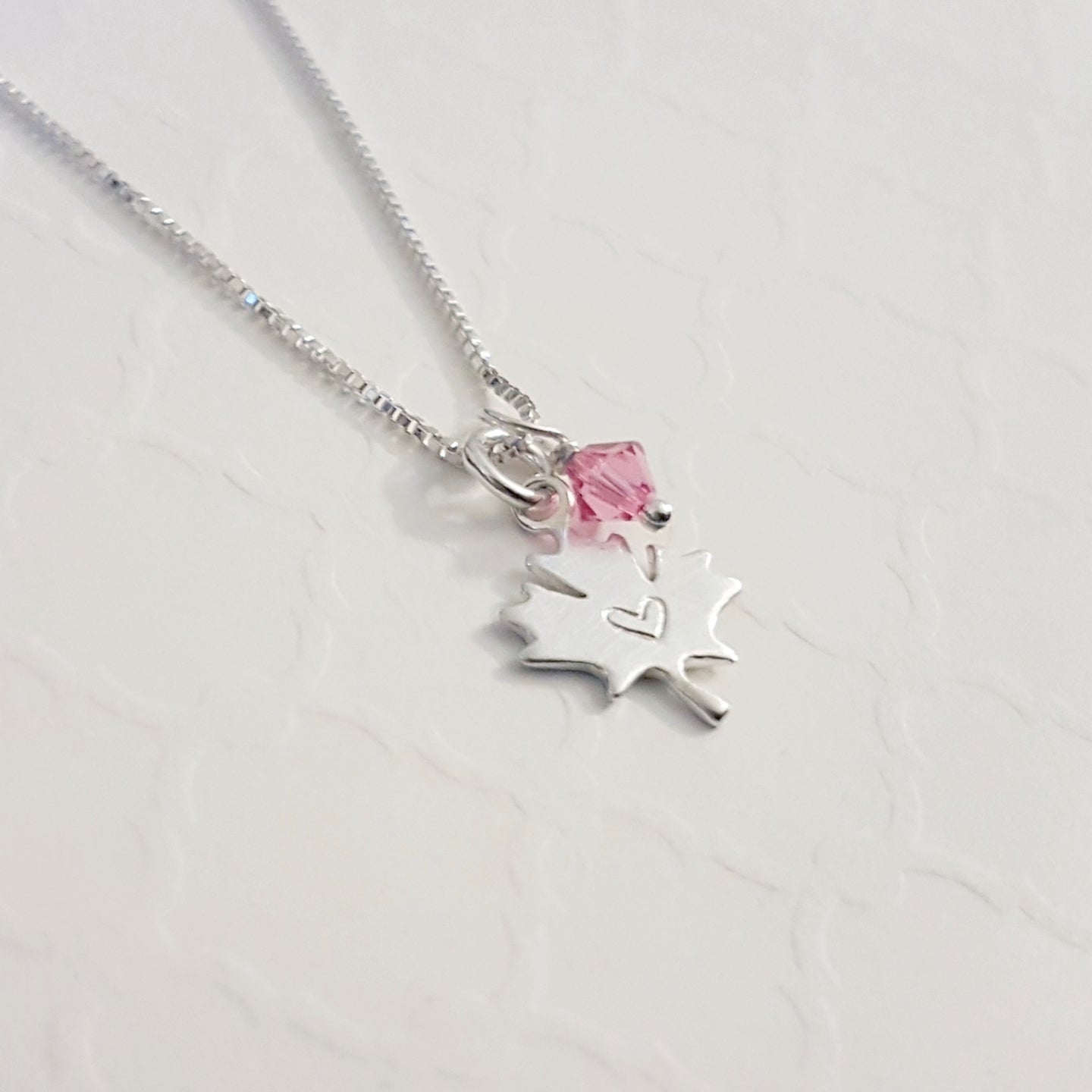 sterling silver maple leaf charm necklace stamped with tiny heart with swarovski birthstone