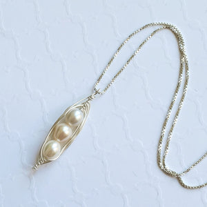 Wire-wrapped sterling silver pea pod necklace with freshwater pearls