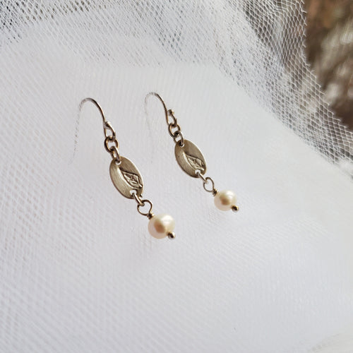 sterling silver hook earrings with freshwater pearls and a stamped leaf design