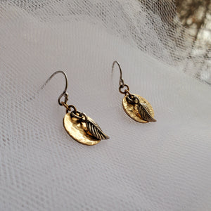 sterling silver hook earrings with hammered yellow gold disc and silver leaf charm