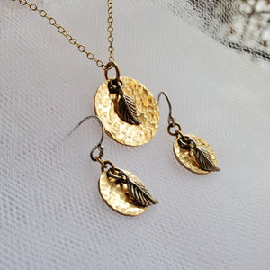 hammered yellow gold necklace with sterling silver leaf charm and matching earrings