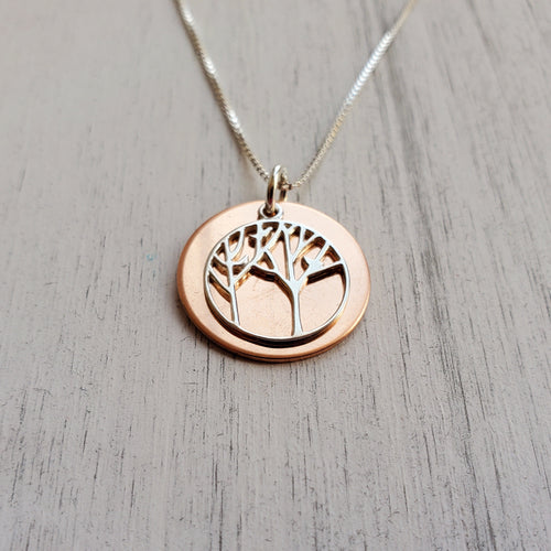 rose gold disc necklace with silver tree of life charm