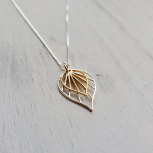 necklace with silver and gold palm leaf pendants