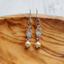 Load image into Gallery viewer, sterling silver hook earrings with swirl pattern, freshwater pearls, and disc stamped with birth flower