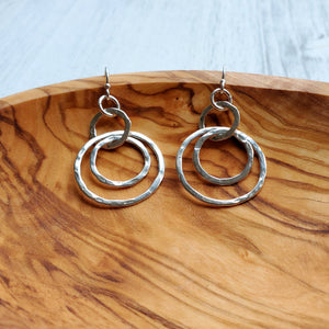dangly silver hook earrings with three interlocking hammered sterling circles
