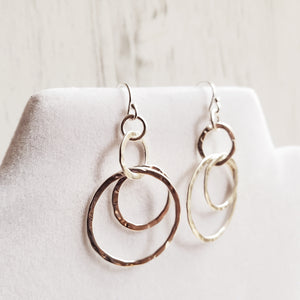 dangly silver hook earrings with three interlocking hammered sterling circles