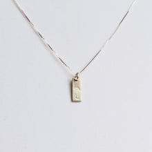 Load image into Gallery viewer, tiny sterling silver tag necklace stamped with birth flower and initial