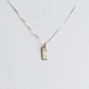 tiny sterling silver tag necklace stamped with birth flower and initial