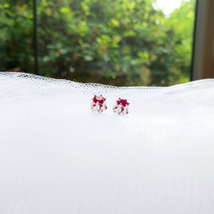 sterling silver buttercup setting stud birthstone earrings with rubies