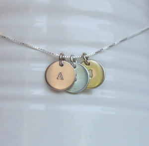 custom necklace with tiny stamped initial discs in sterling silver, rose and yellow gold